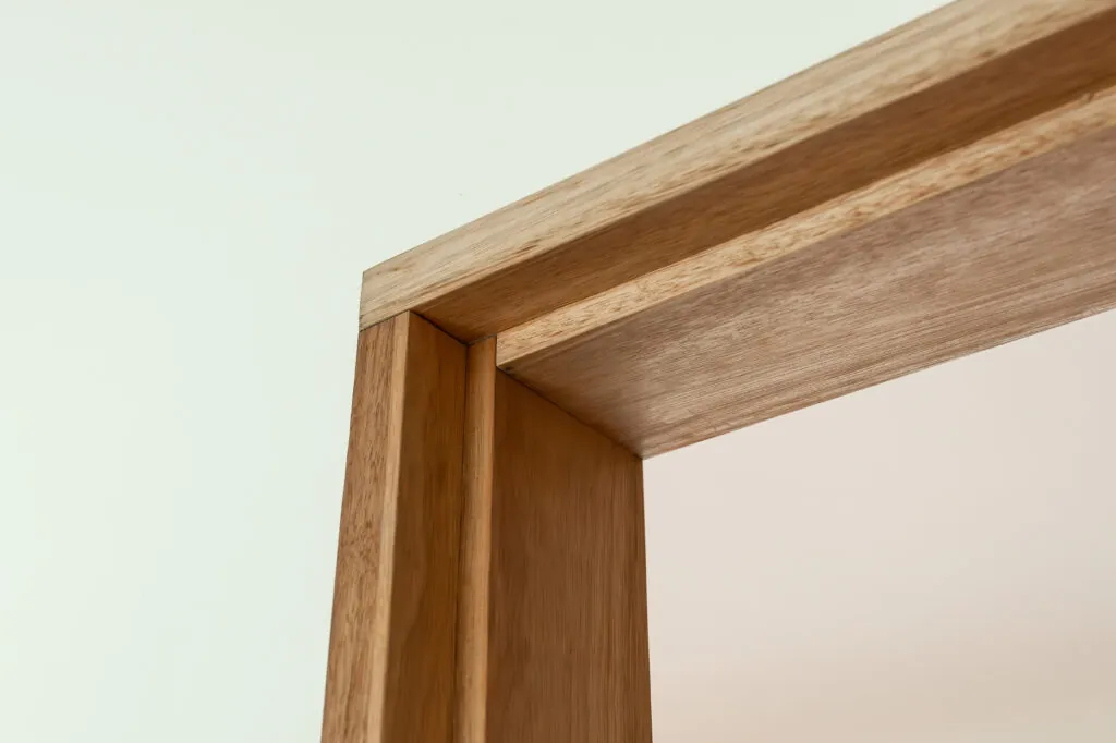 An image of the corner of a doorway and white walls